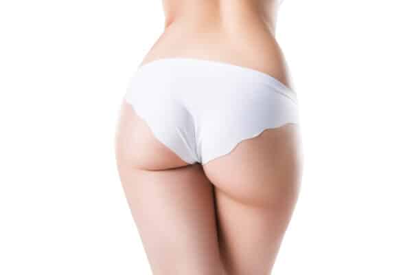 Perfect female buttocks isolated on white background