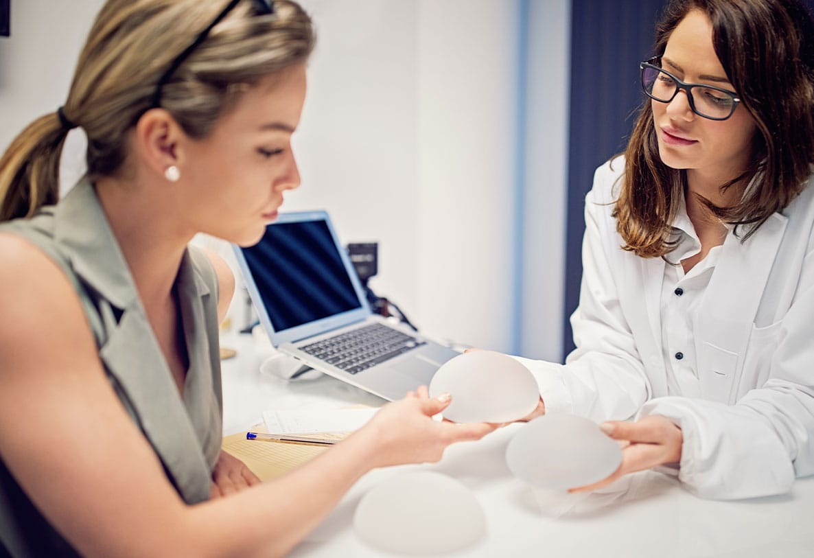 woman choosing implant sizes for her breast augmentation inNewport News, VA