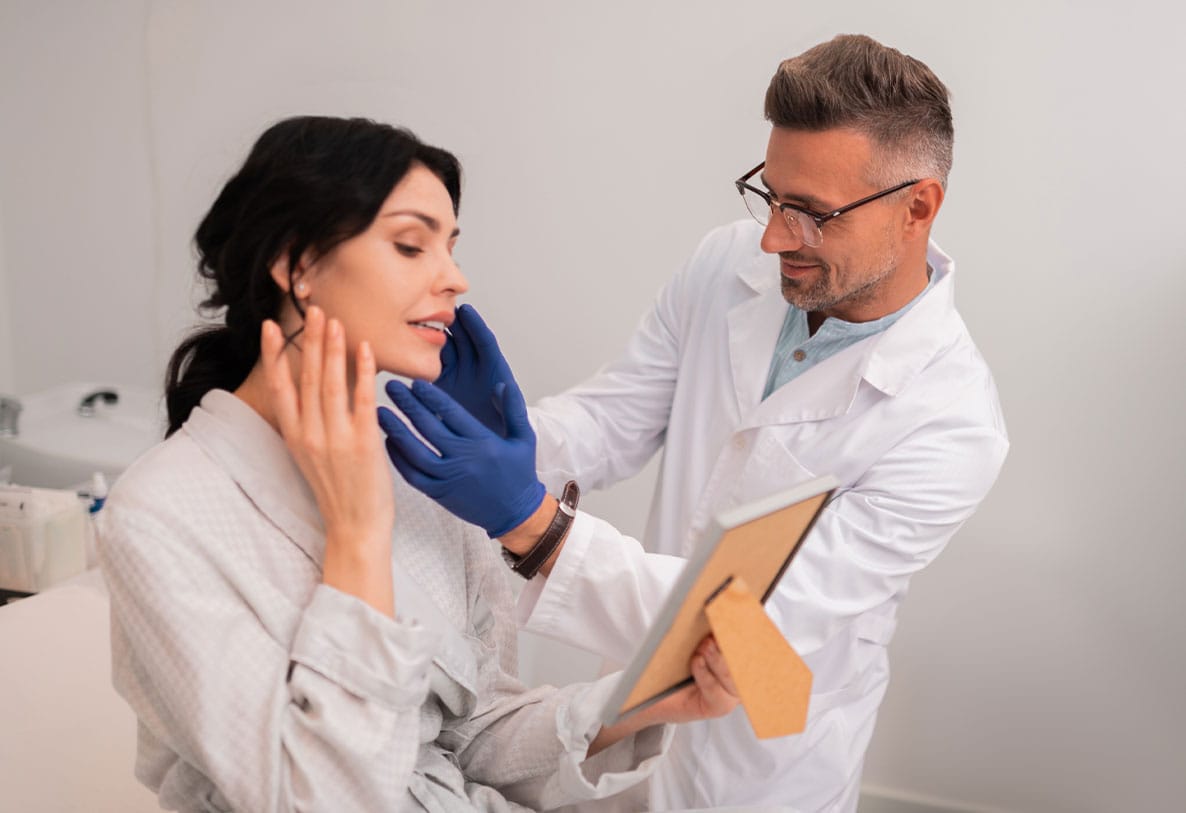 patient in Hampton Roads having a consultation with her plastic surgeon