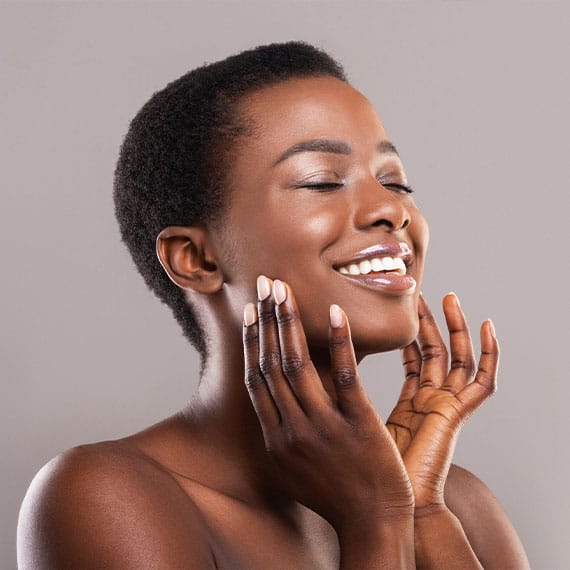 woman smiling after getting medspa treatments in Williamsburg, VA