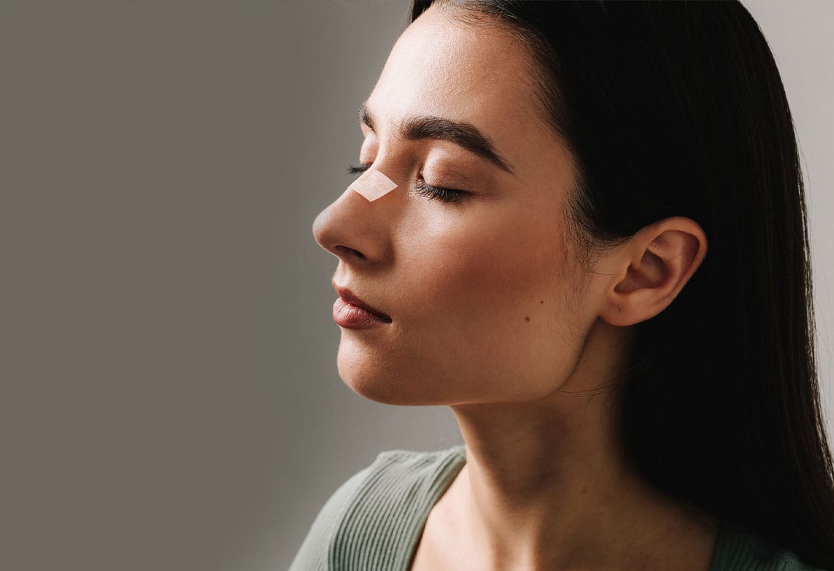 woman recovering from plastic surgery in Coastal Virginia