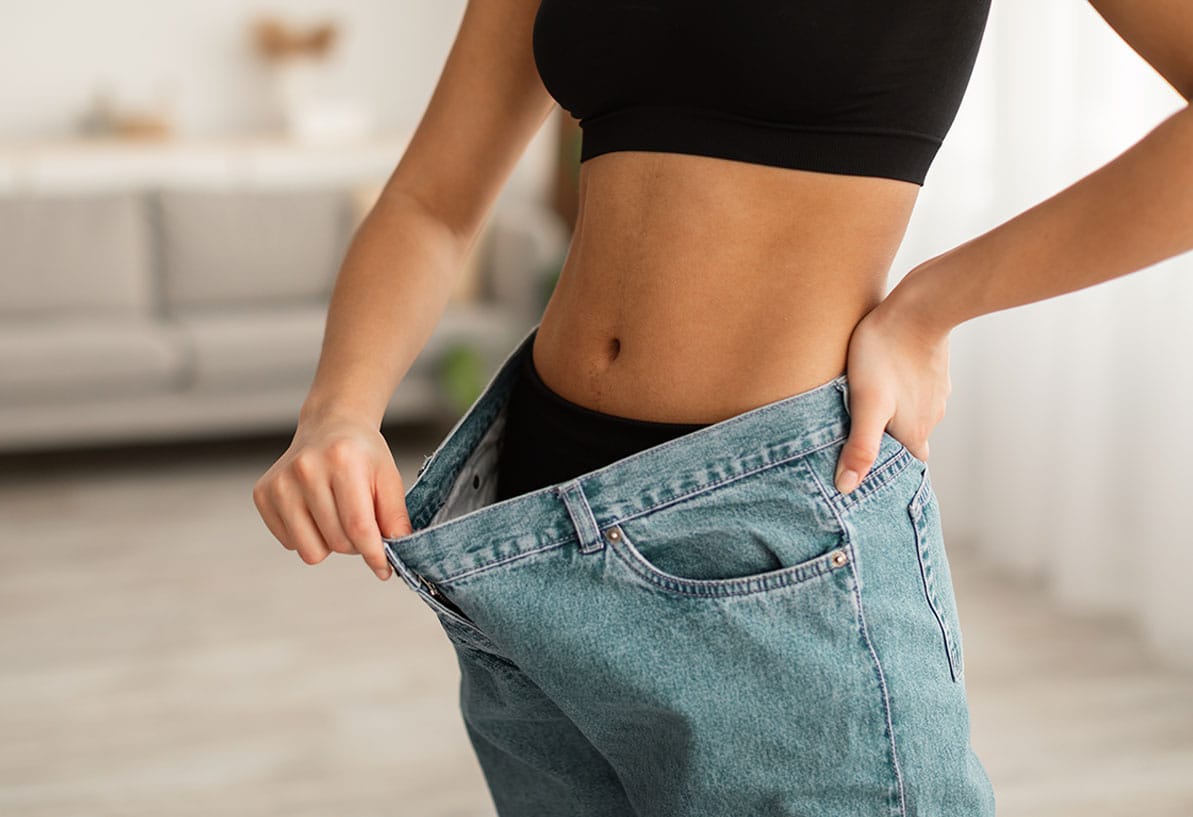 woman showing off her weight loss in Newport News, VA
